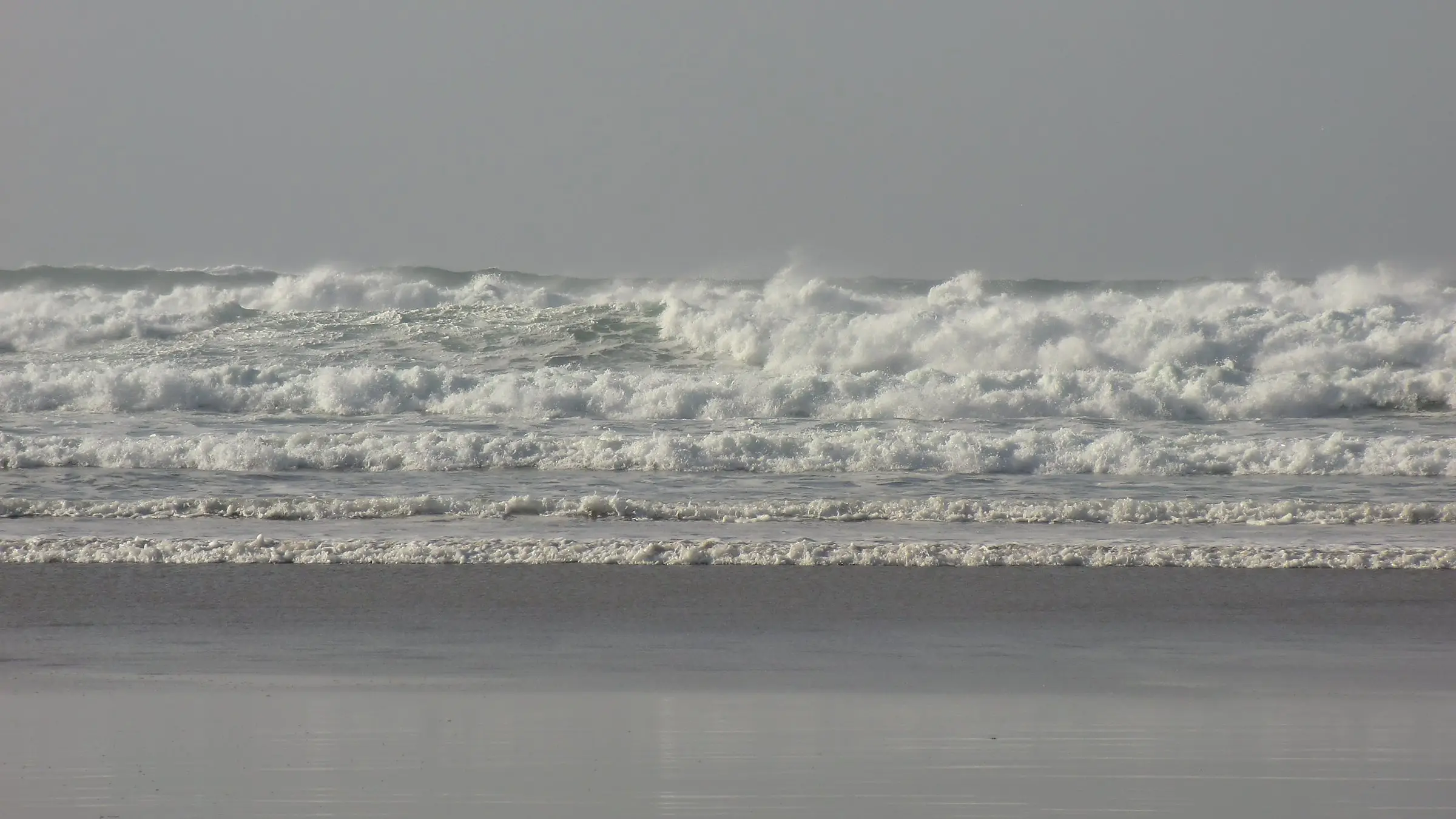 Perranporth Beach — wide Atlantic sand stretching toward Ligger Point.