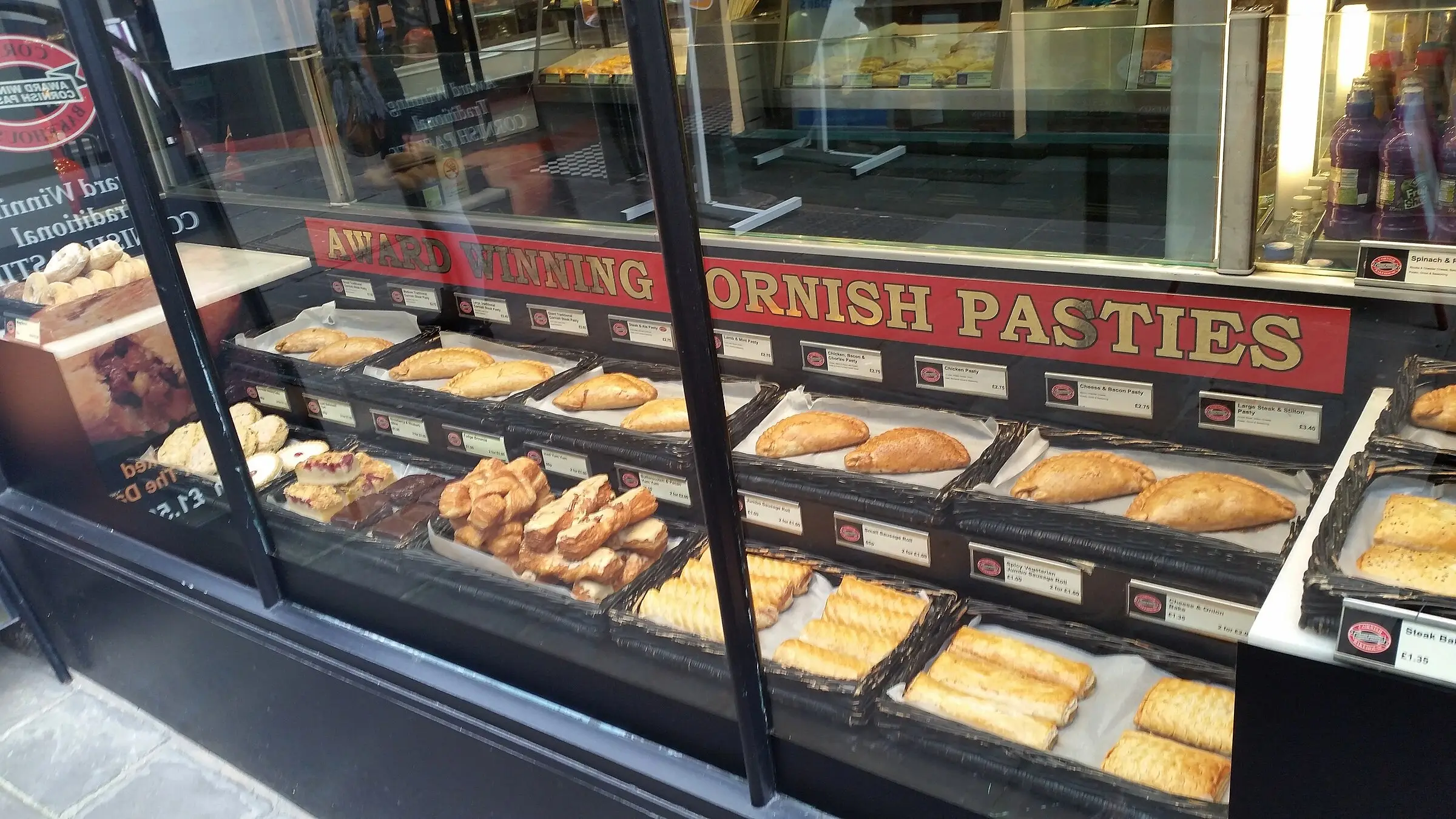 Traditional Cornish pasties — golden crimped pastry with the characteristic D-shaped seal.