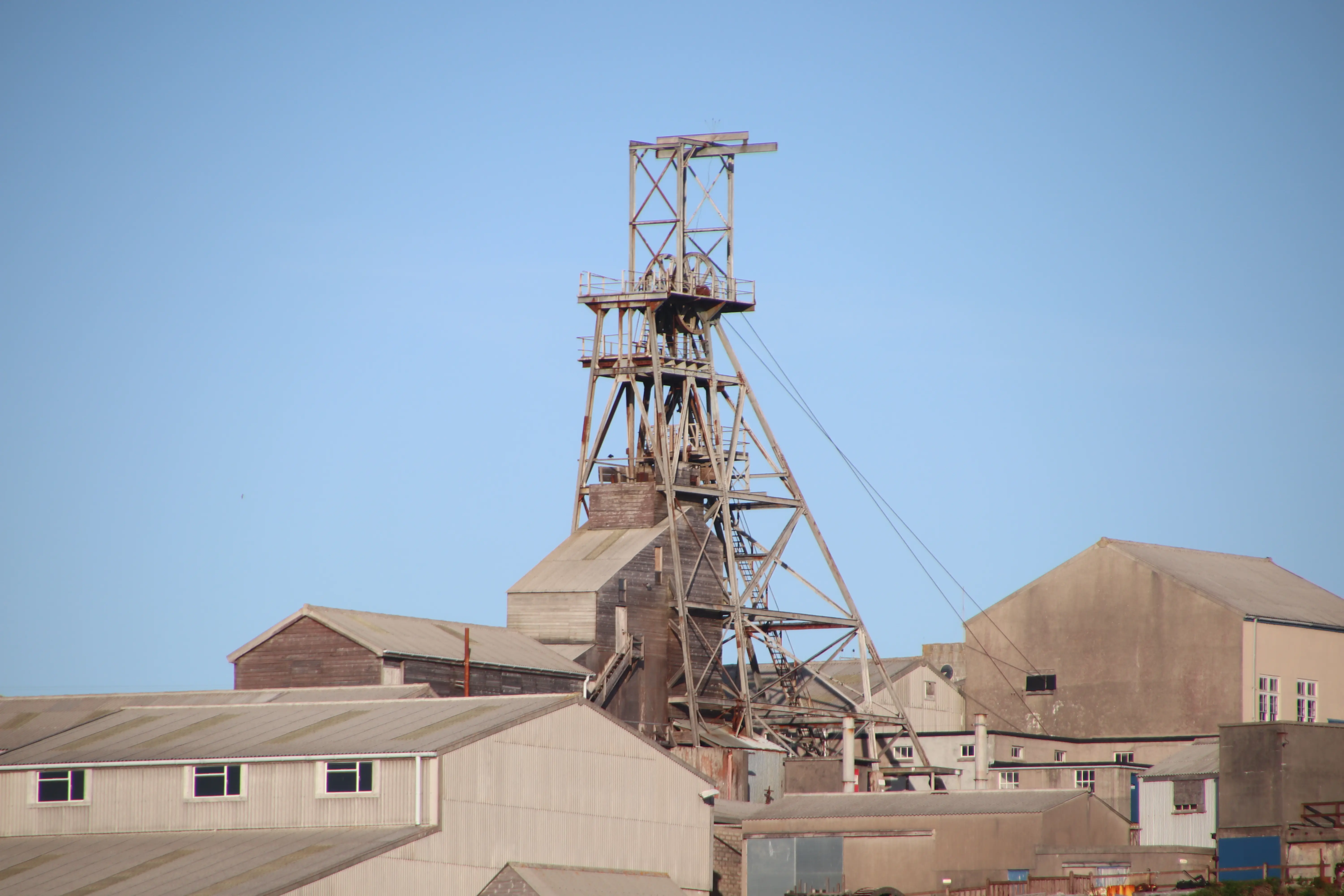 Geevor Tin Mine at Pendeen — the headframe and engine house buildings against the clifftop.