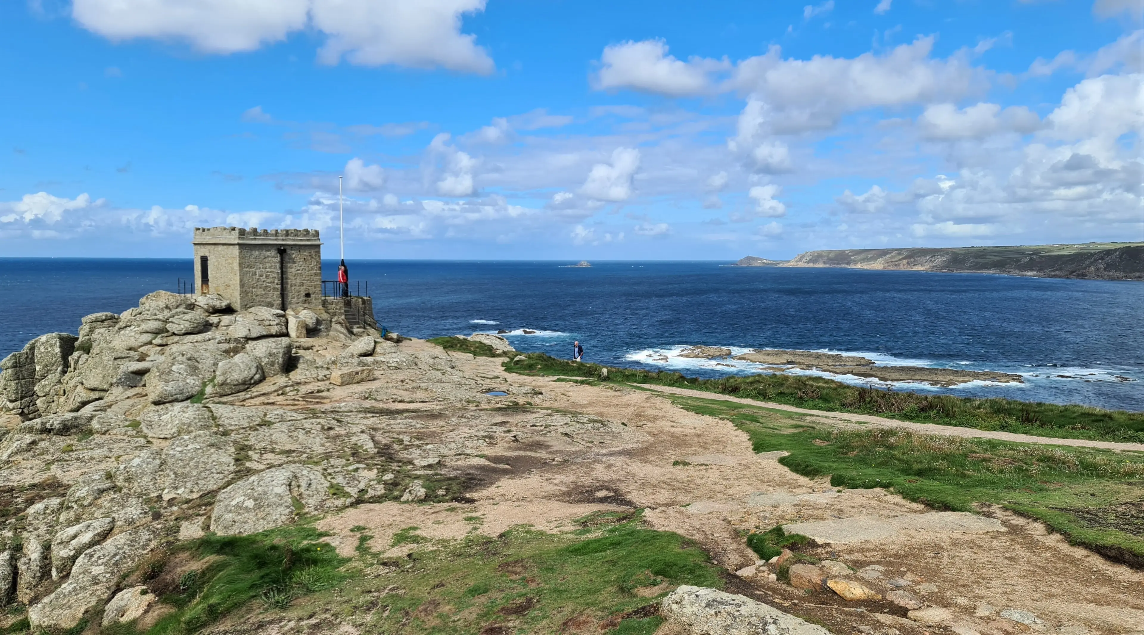 Sennen Cove — the last surf beach before Land's End, with clean Atlantic waves breaking on white sand.